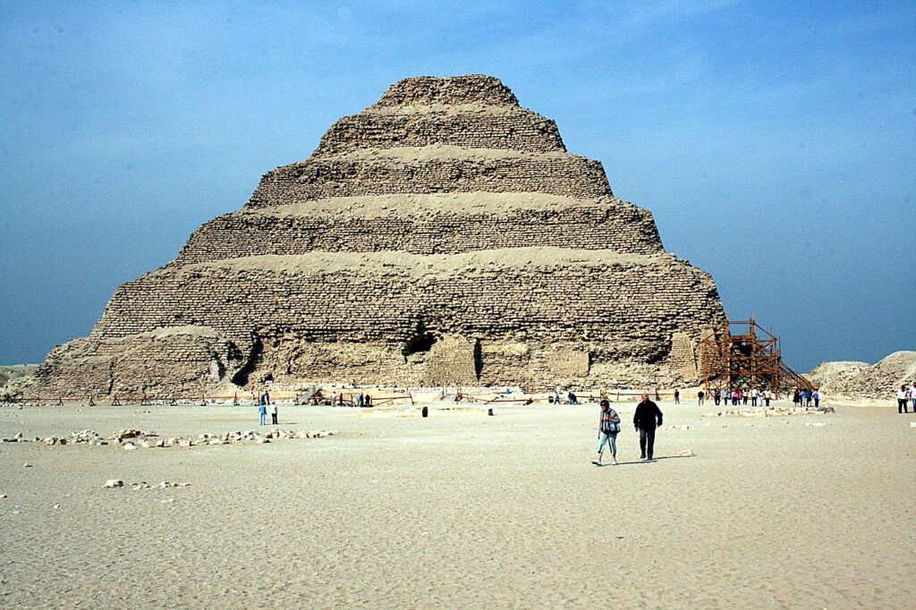 The Step Pyramid of Djoser in Saqqara, Egypt, an early stone pyramid with stepped layers.
