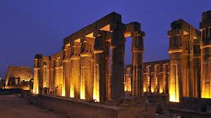 "Luxor Temple illuminated at night on the east bank of the Nile in Luxor, Egypt."