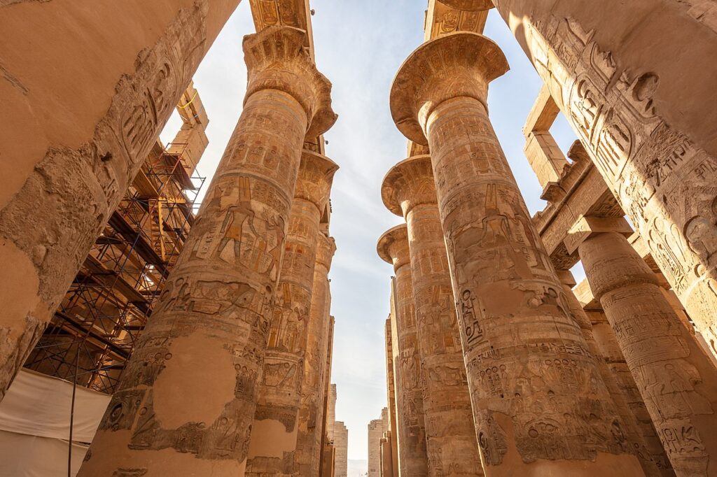 The Great Hypostyle Hall in the Karnak Temple Complex, Luxor, Egypt, with massive columns and hieroglyphic carvings.