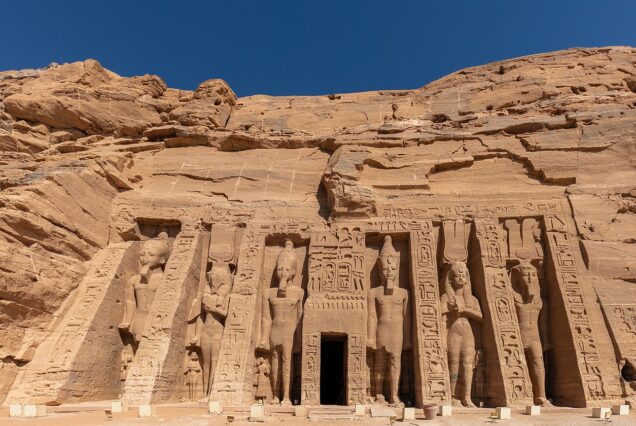 Facade of the Temple of Nefertari (Small Temple) at Abu Simbel with statues of Queen Nefertari and Ramesses II.