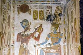 Relief carving of Pharaoh Seti I making an offering to the god Amun-Ra inside the Temple of Seti I at Abydos, Egypt.