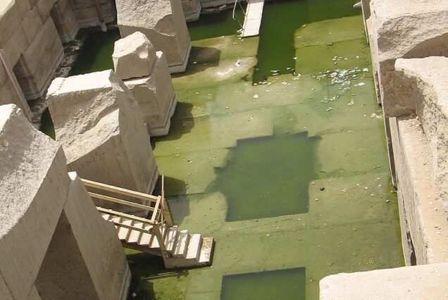 The Osireion at Abydos, featuring massive stone pillars surrounded by a water channel.