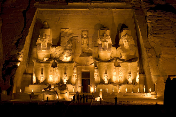 The Great Temple of Abu Simbel with four colossal seated statues of Ramesses II carved into the cliff face in southern Egypt.