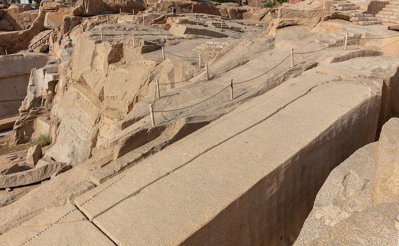 The Unfinished Obelisk lying horizontally in the granite quarry at Aswan, showing visible cracks and tool marks.