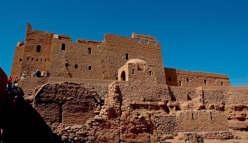 View of the Monastery of St. Simeon in Aswan, an ancient Coptic Orthodox fortress-like structure built of stone and mud brick.