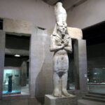 A colossal statue of Pharaoh Ramesses II displayed inside the Nubian Museum in Aswan, Egypt.