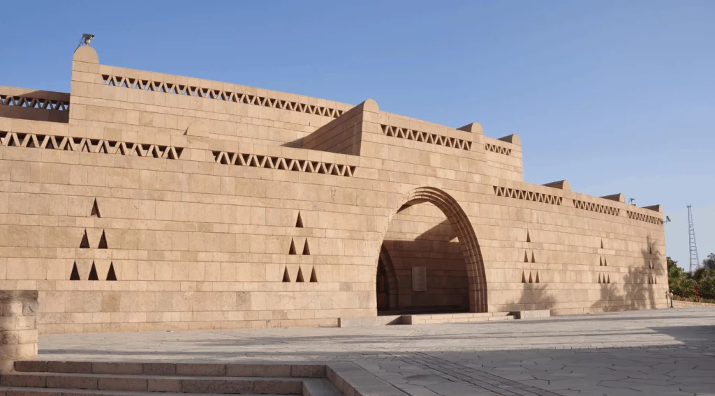 The Nubian Museum in Aswan, Egypt, showcasing traditional Nubian architectural style with sandstone and pink granite exterior.