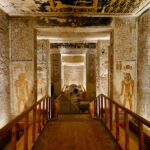 Interior view of a decorated tomb in the Valley of the Kings, featuring colorful hieroglyphs and ancient Egyptian wall paintings.