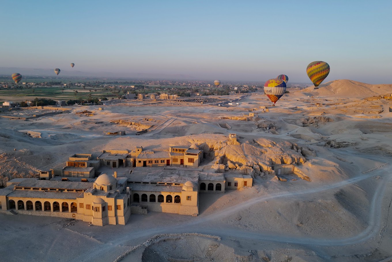 Hot air balloons over Luxor’s West Bank at sunrise, with views of the Nile and Valley of the Kings