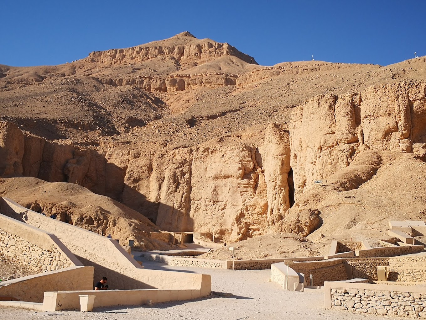 Valley of the Kings in Luxor, Egypt, showing the royal burial site carved into limestone cliffs.
