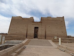 The Temple of Kalabsha, featuring its grand stone entrance and detailed reliefs, located on New Kalabsha Island near Aswan, Egypt.