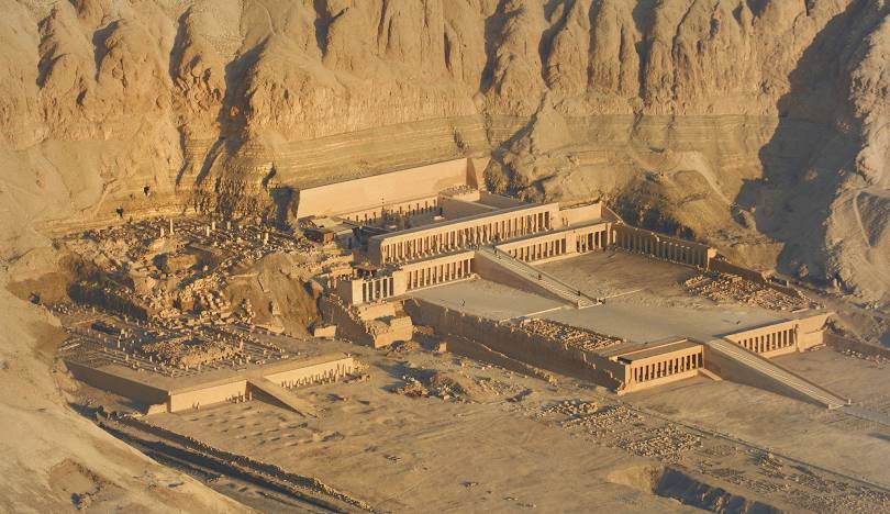 The Mortuary Temple of Hatshepsut at Deir el-Bahari, Luxor, with its unique terraced design and colonnaded courtyards.
