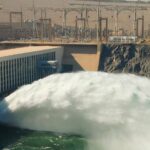 The High Dam Aerial view of the Aswan High Dam spanning the Nile River near Aswan, Egypt, with Lake Nasser visible behind it.