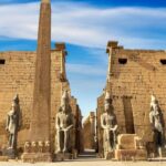 Luxor Temple with its massive pylon, colossal statues, and grand colonnade on the east bank of the Nile in Luxor, Egypt.