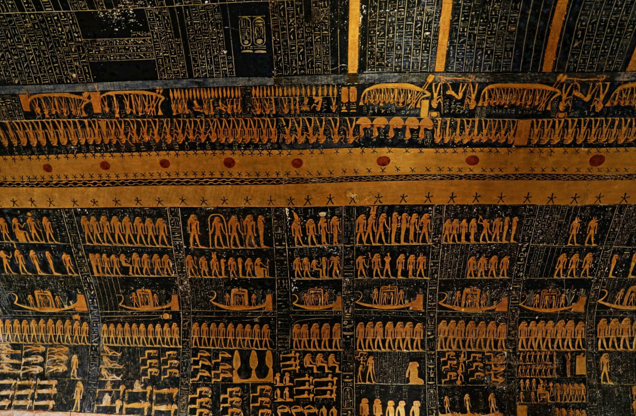 Intricate wall decorations and hieroglyphs inside a New Kingdom tomb in the Valley of the Kings near Luxor, Egypt.