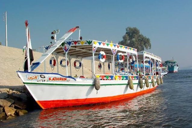 Traditional Egyptian motorboat on the Nile River in Aswan, used for tours to the Nubian Village.
