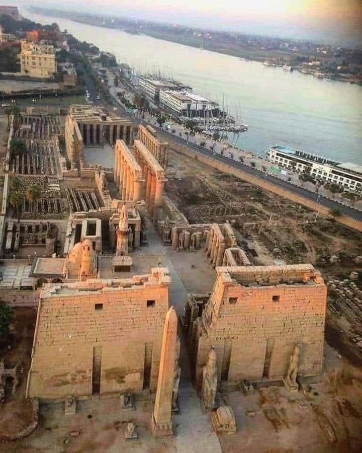 "Luxor Temple on the east bank of the Nile in Luxor, Egypt, showing monumental pylons, statues, and ancient relief carvings."