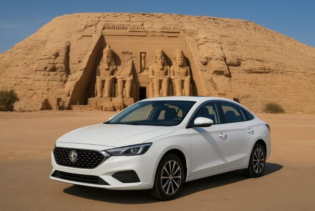 White MG5 sedan parked in front of the Great Temple of Ramesses II at Abu Simbel, Aswan, Egypt.