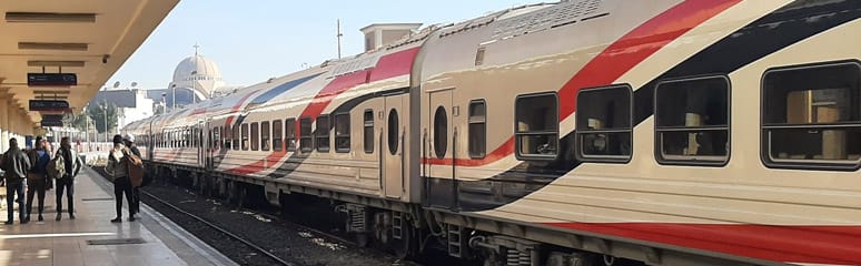Egyptian National Railways (ENR) train at Aswan Railway Station, part of one of the world’s oldest railway systems connecting cities like Cairo and Luxor.