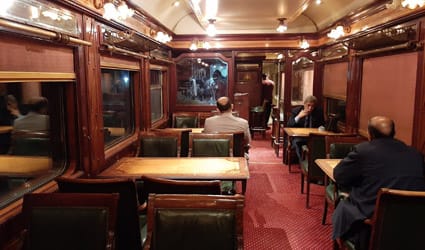 Interior of the dining car on the Ernst Watania Sleeping Train in Egypt, offering onboard catering during sleeper train journeys to destinations such as Luxor and Aswan.