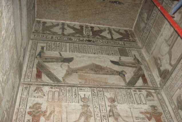 Interior of the Temple of Hathor at Dendera, Egypt, featuring colorful wall paintings, detailed hieroglyphs, and astronomical ceiling engravings.