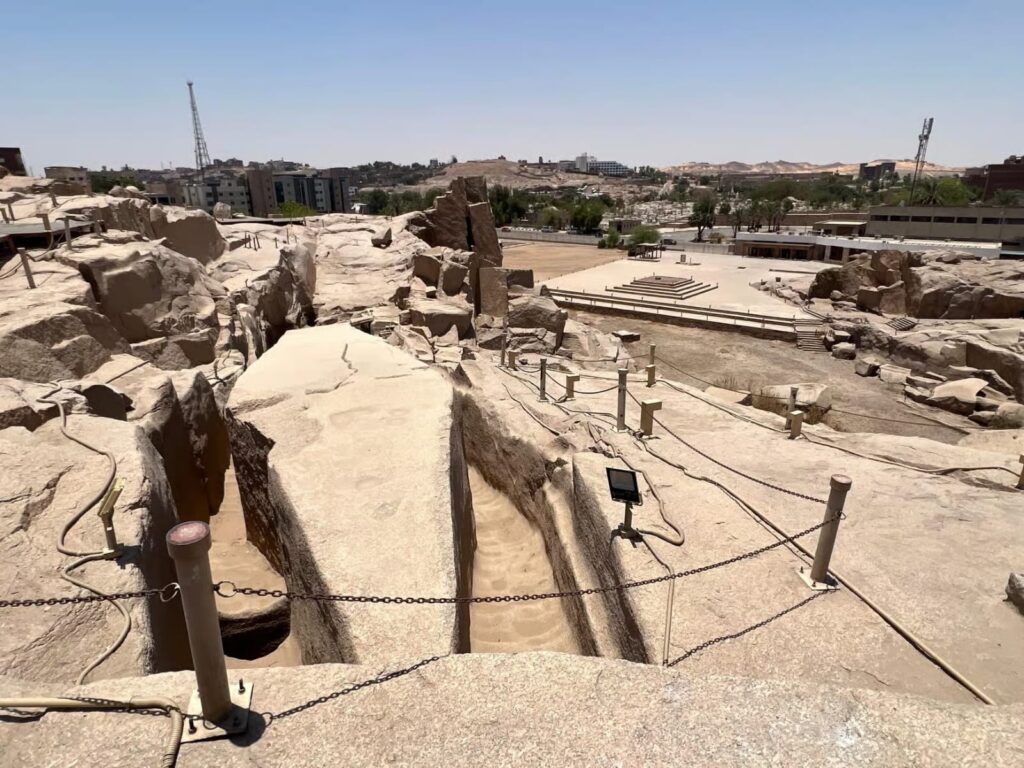 The Unfinished Obelisk in the Aswan granite quarries, showing cracks and tool marks from ancient Egyptian quarrying.
