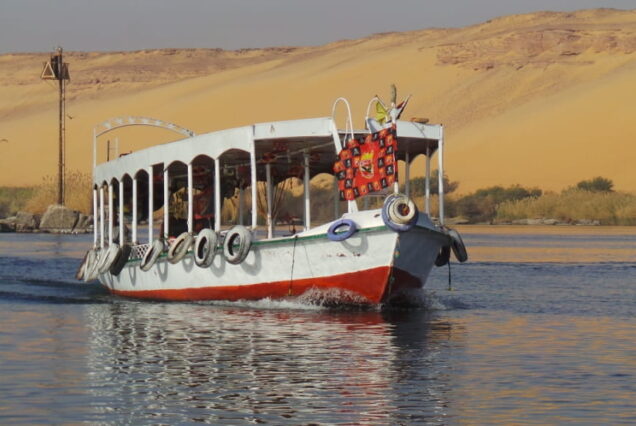 Traditional Egyptian motorboat on the Nile River in Aswan, used for tours to the Nubian Village.