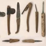 A collection of ancient embalming tools used in funerary practices, including scalpels, hooks, and probes for preparing the body.