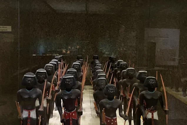 Collection of ancient Nubian warrior statues displayed in the Nubian Museum, Aswan, Egypt.