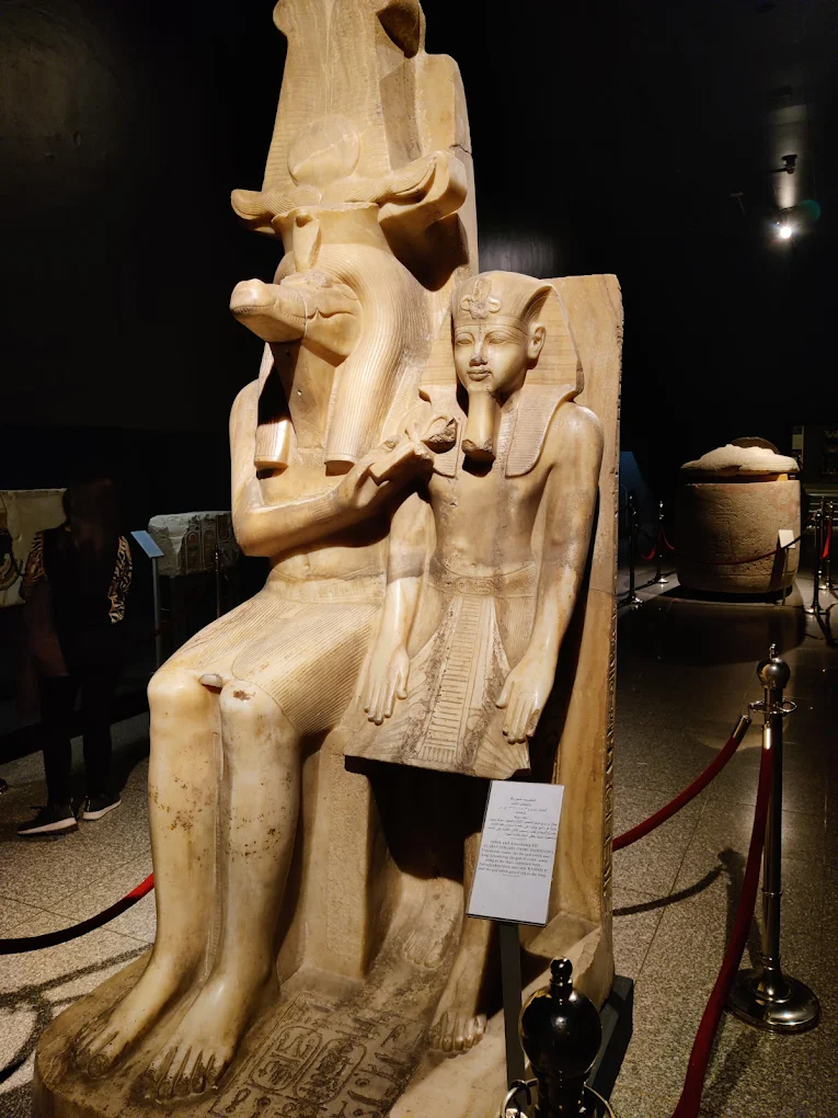 Double statue of the crocodile-headed god Sobek and Pharaoh Amenhotep III, carved from calcite, displayed in the Luxor Museum.