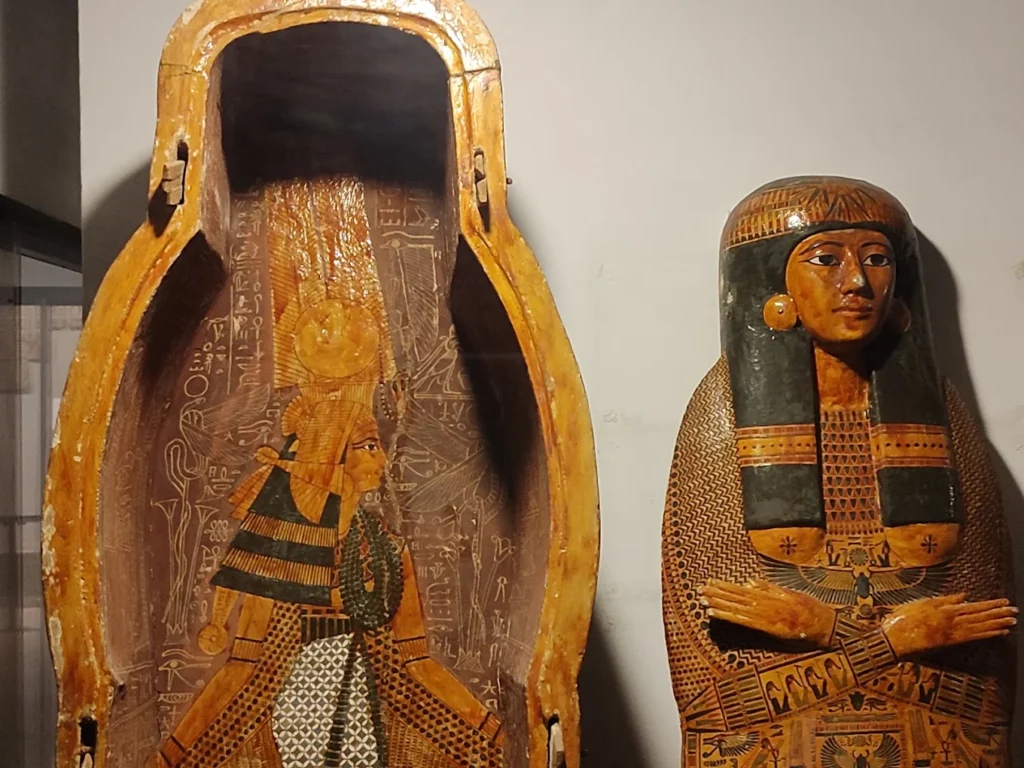 Ancient Egyptian coffin and mummy board of Pasebakhaemipet, decorated with intricate artwork, from the New Kingdom period.