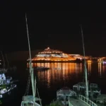 Nighttime view of the illuminated Tombs of the Nobles on the West Bank of the Nile in Aswan, Egypt.