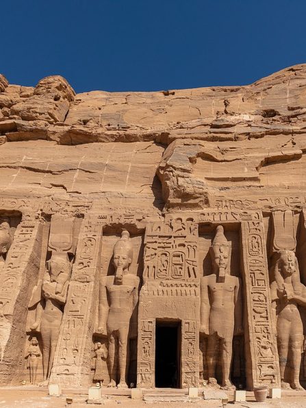 Facade of the Temple of Nefertari (Small Temple) at Abu Simbel with statues of Queen Nefertari and Ramesses II.
