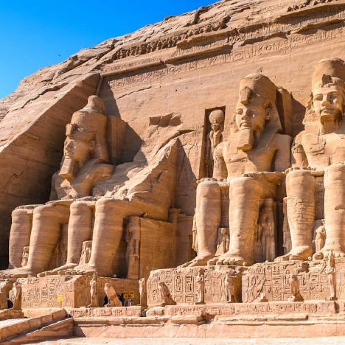 The facade of the Great Temple of Abu Simbel with colossal statues of Ramses II, Nubia, Egypt